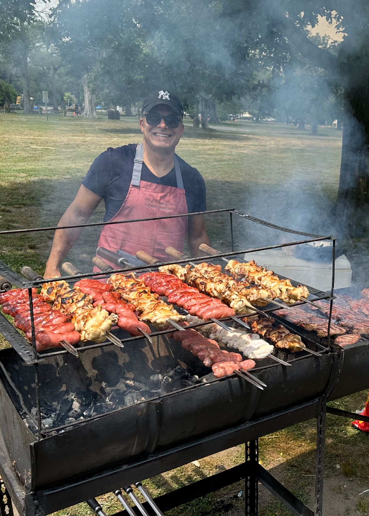 Chef grilling churrasco at outdoor event