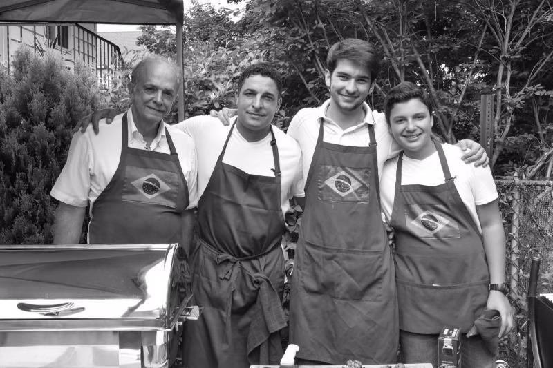 Chef Claudinei and team in Brazilian flag aprons